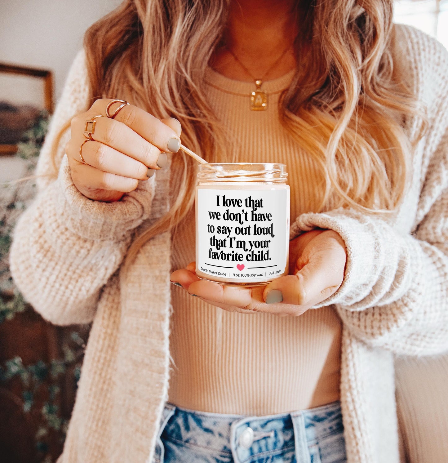 a woman holding a jar with a quote on it