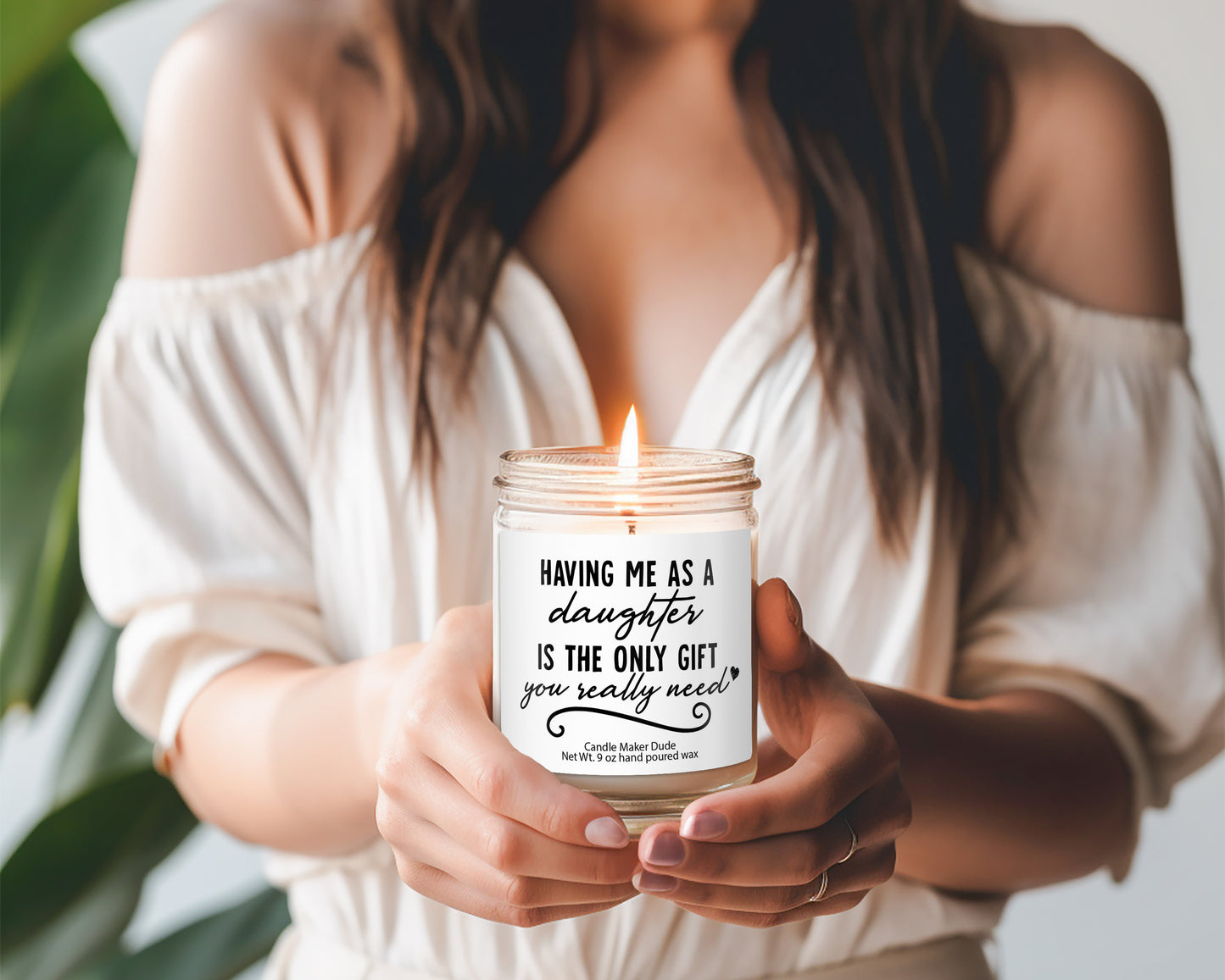 a woman holding a candle in her hands