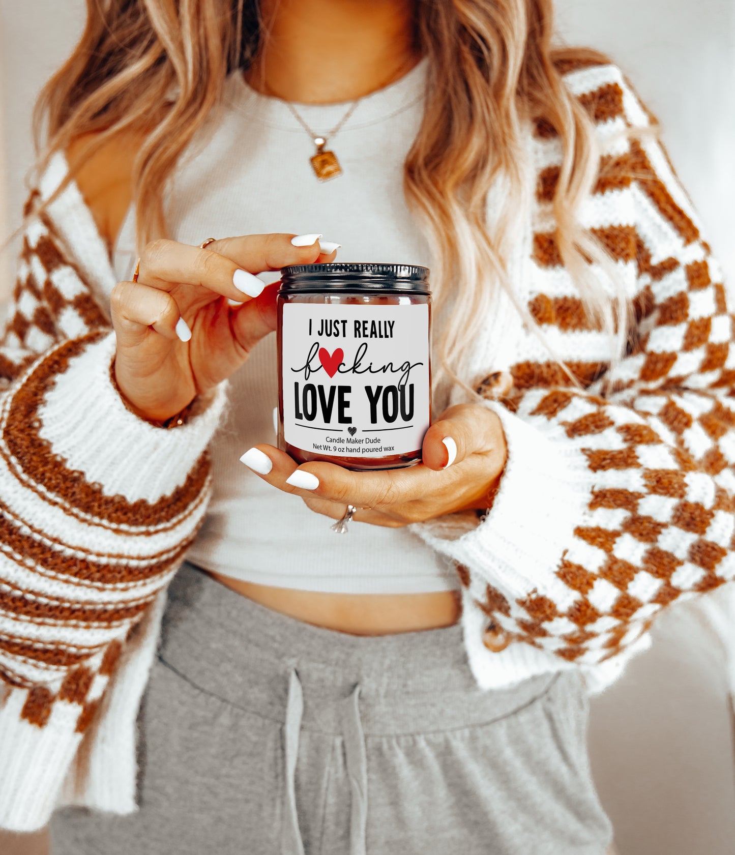 a woman holding a jar of love you