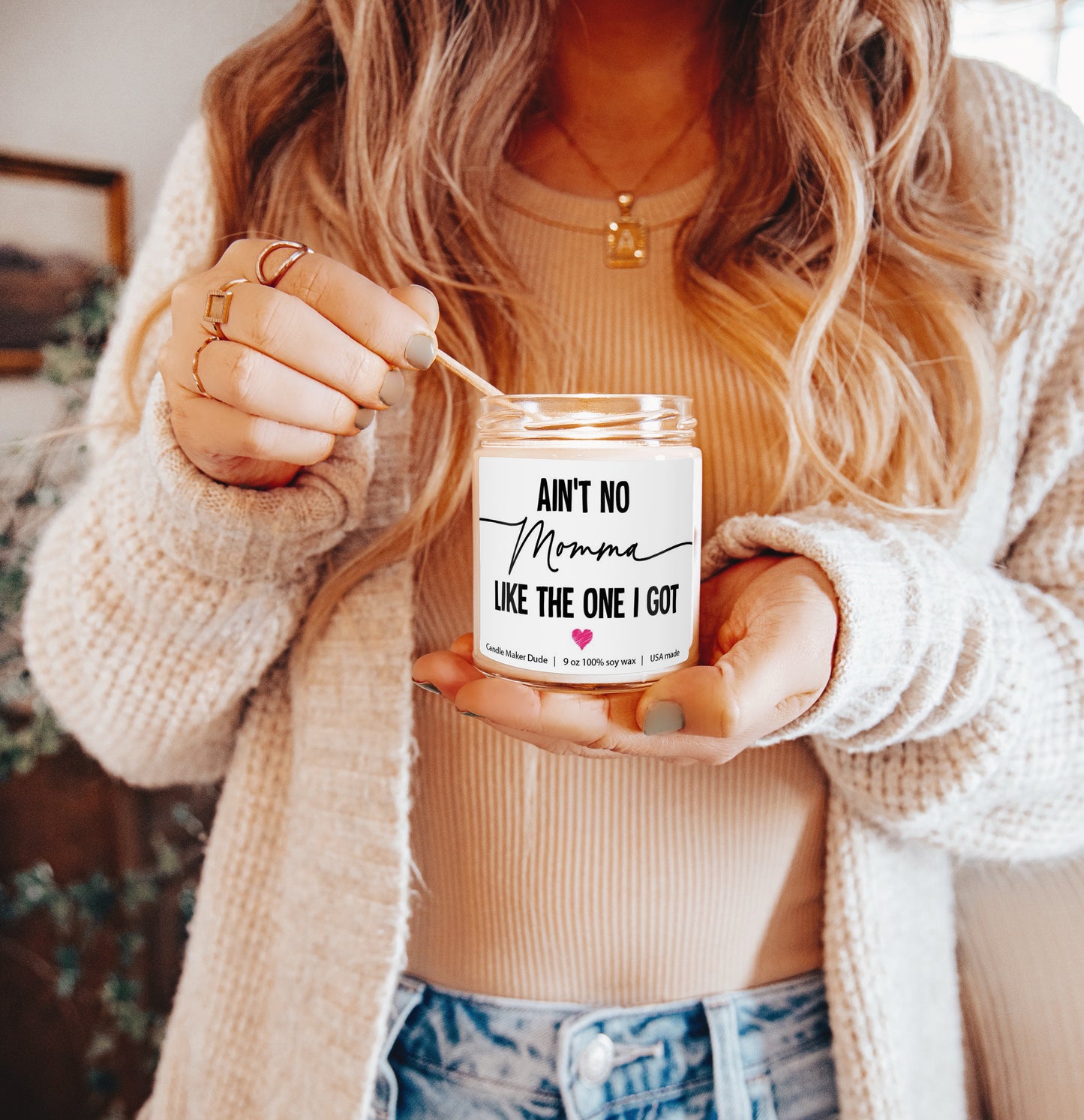 a woman holding a jar with a message on it