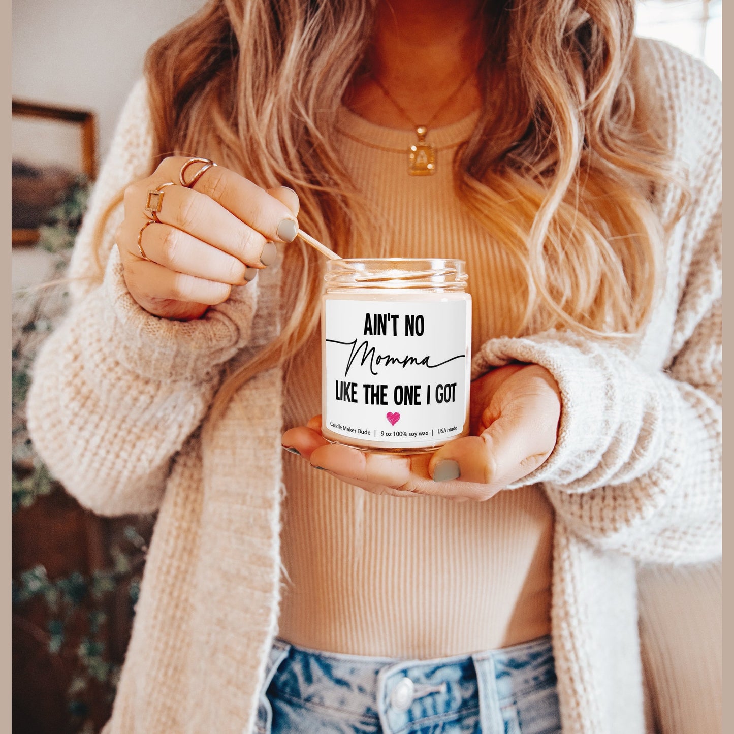 a woman holding a jar with a message on it