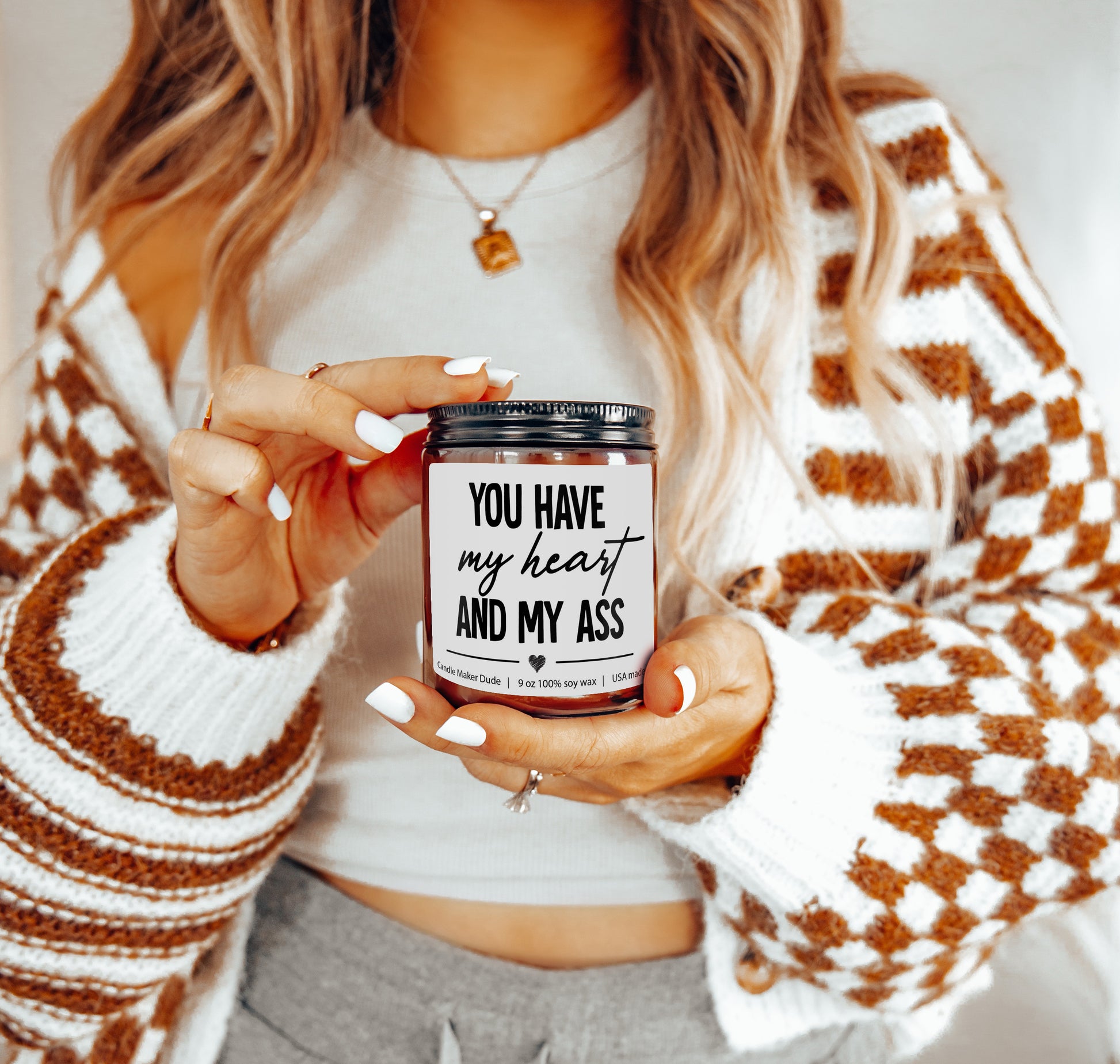 a woman holding a jar of peanut butter